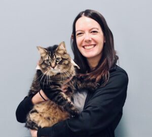 Dr. Rohan holding her Tabby Cat