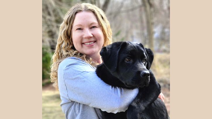 Veterinarian Dr. Cheryl Brocki with her puppy Jasper