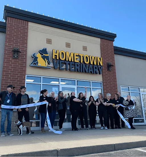 Hometown Vet Partners tea, cutting ribbon